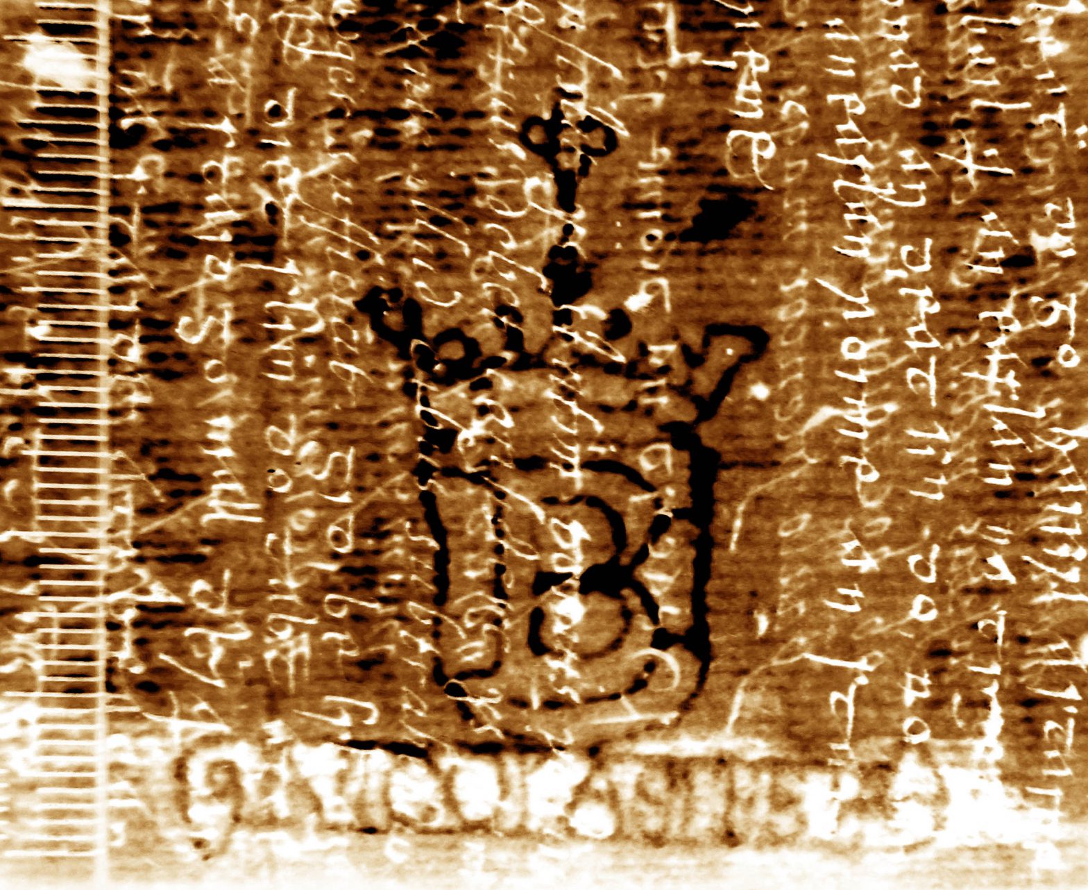 Quatrefoil on shield with letter B, over scroll containing name